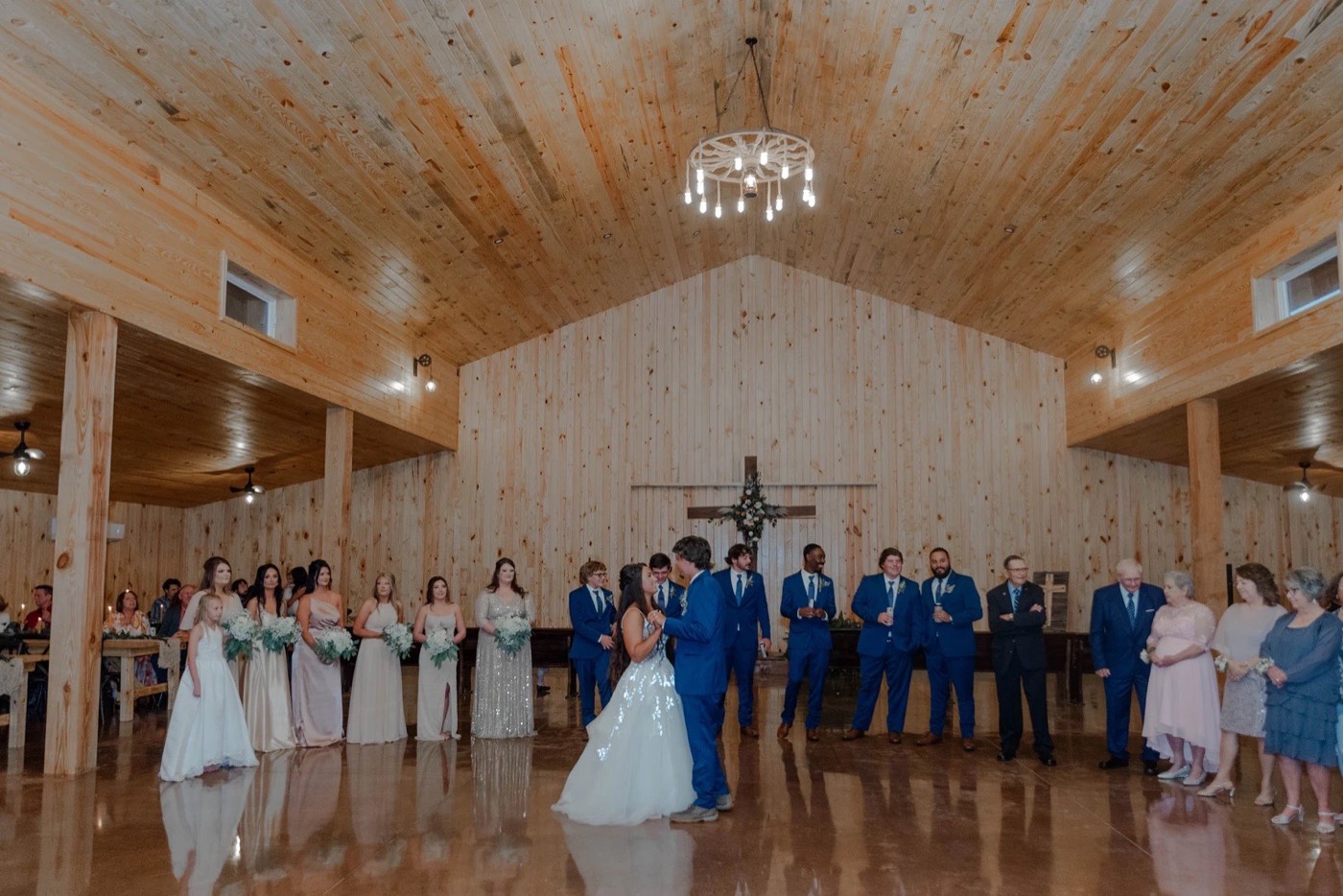 First dance under the chandeliers inside the Grant Gables event barn