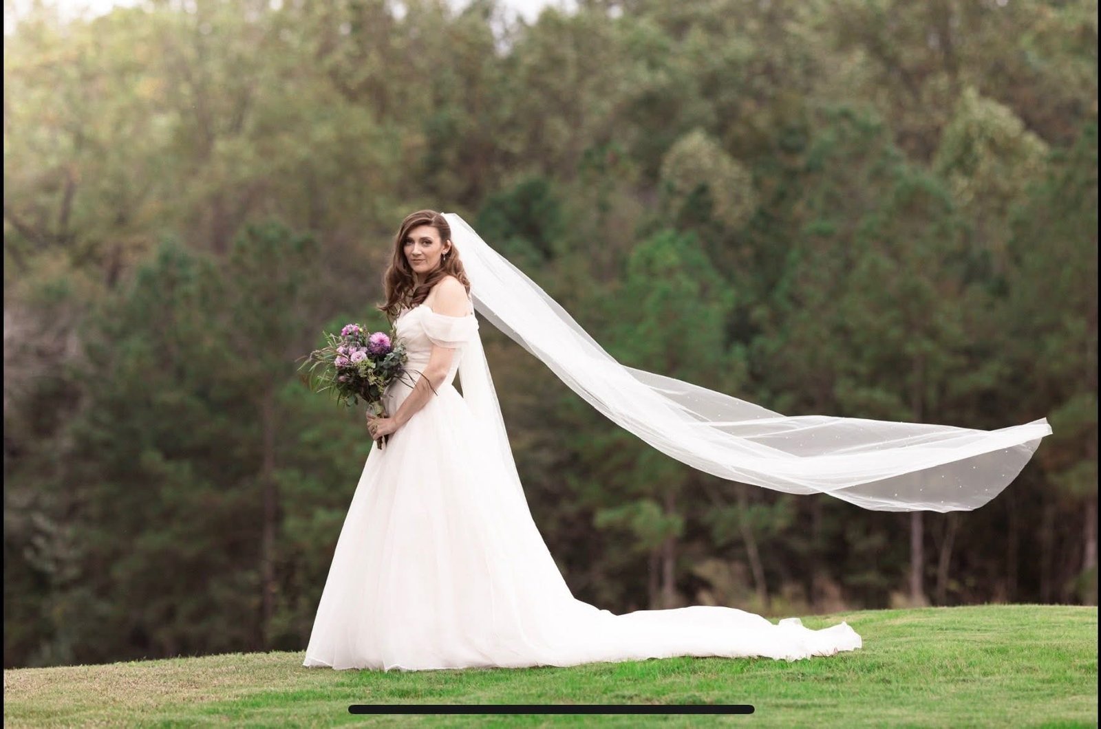 Bride walking the scenic grounds at Grant Gables Venue