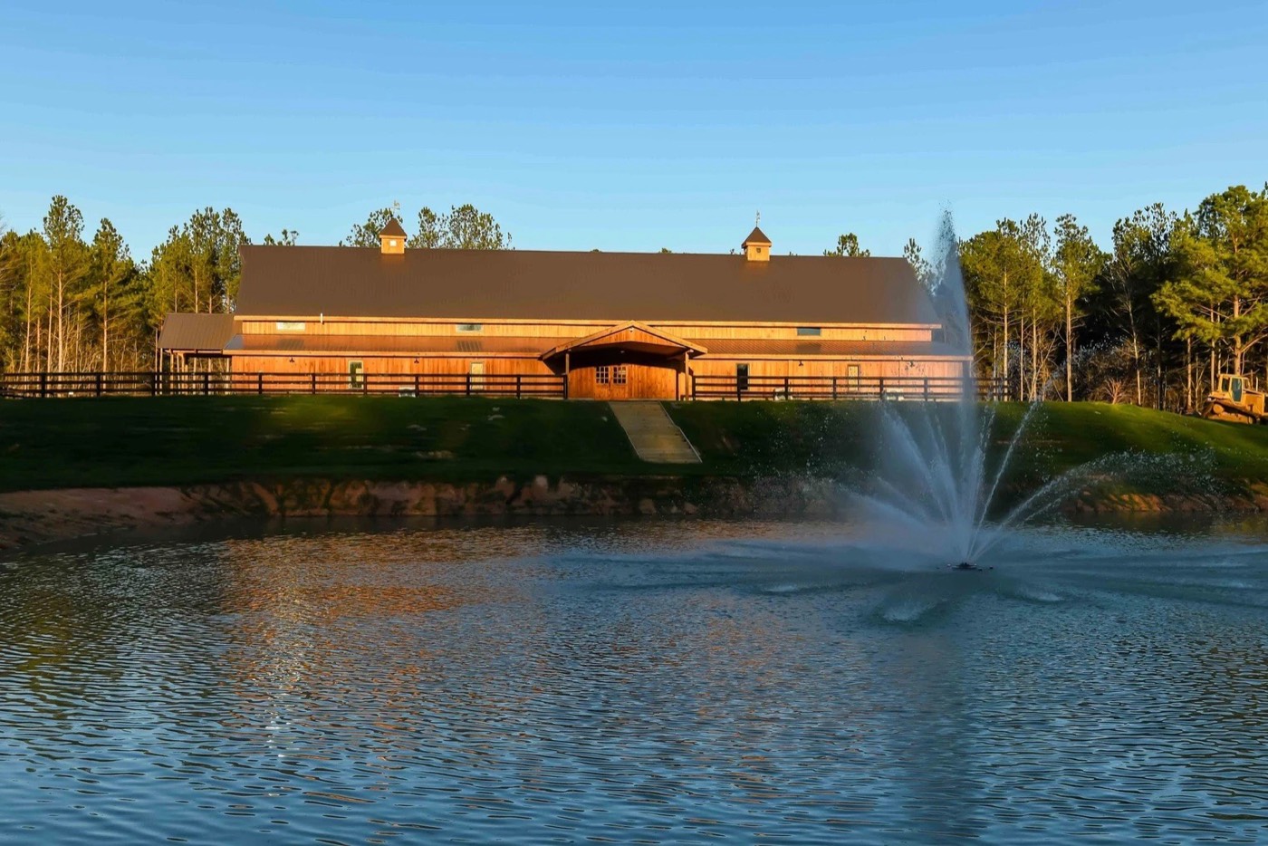 The Grant Gables event barn across the pond with its fountain in view