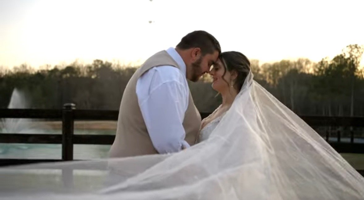 Couple portrait near the water at Grant Gables Venue
