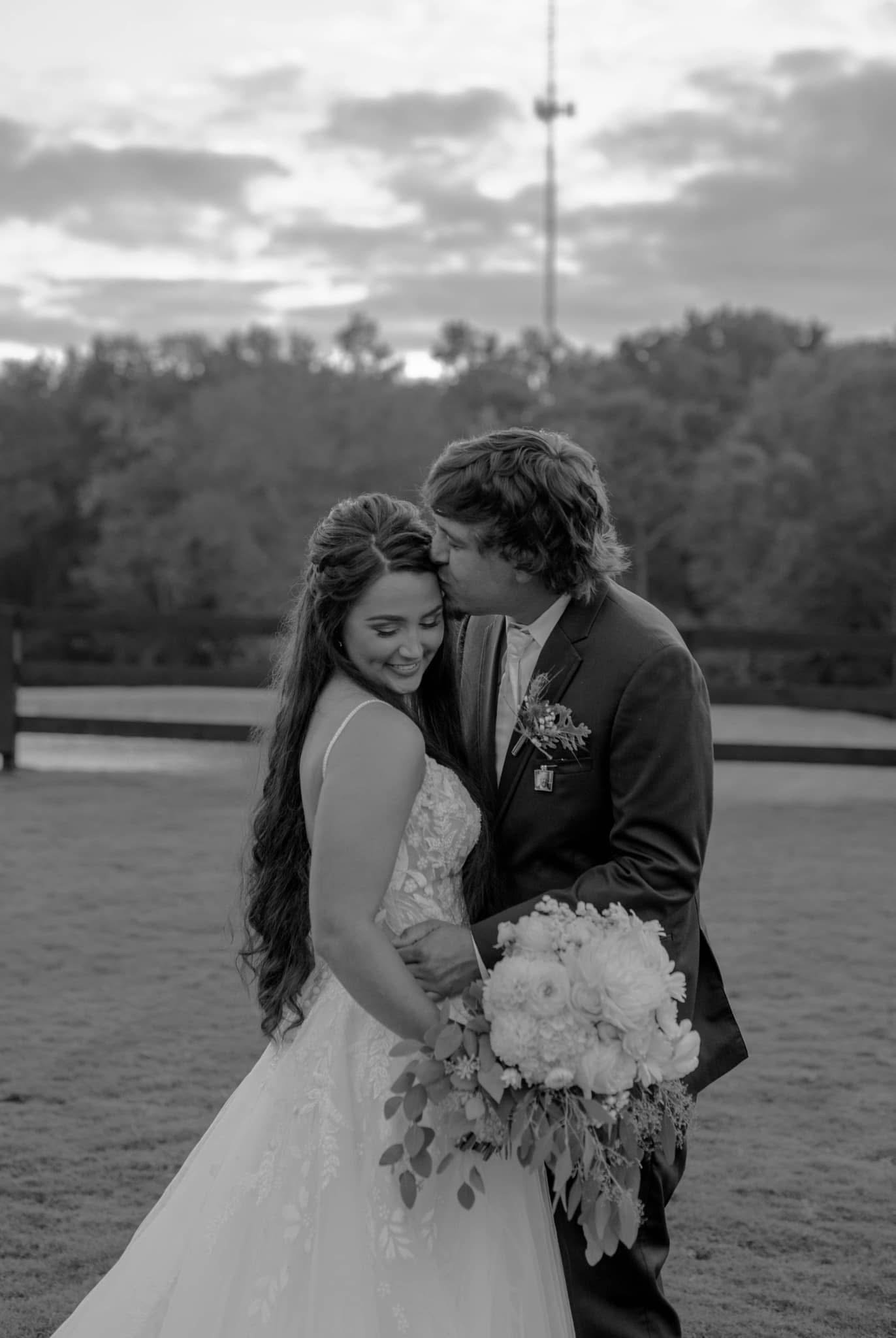 Groom and wedding party gathered at Grant Gables Venue